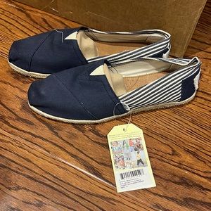 TOMS shoes brand new with tags. Navy and white. Size 11.
